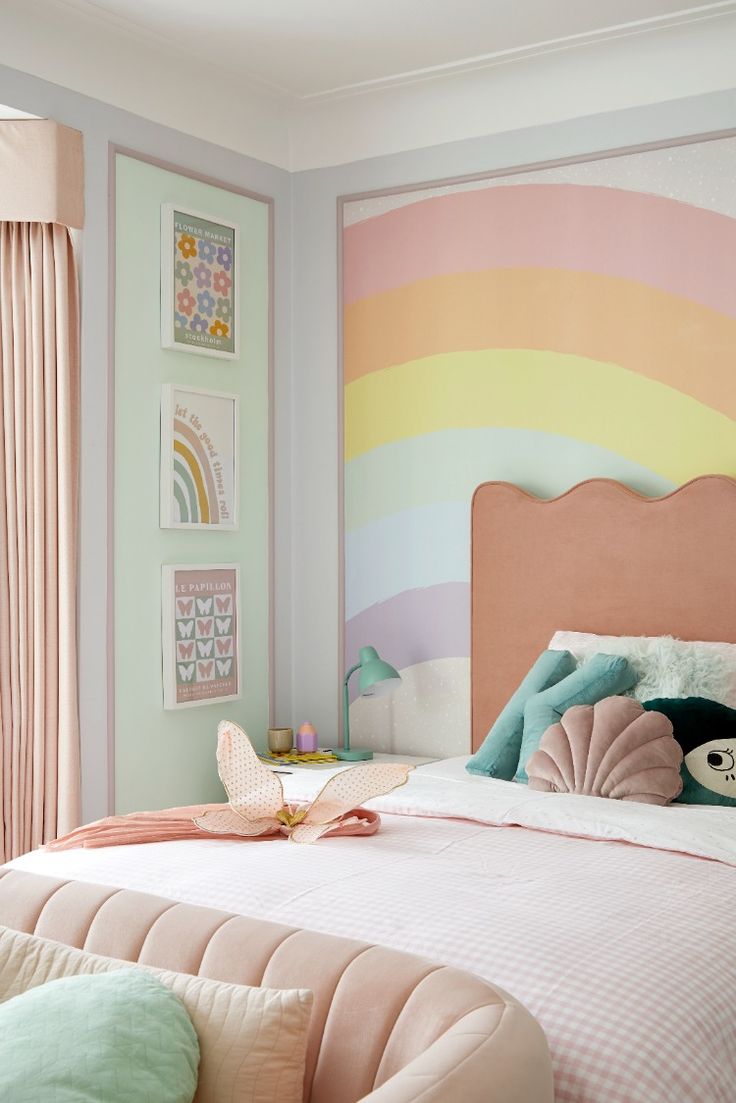 a bedroom with pastel colors and pink, green, yellow, and blue accents