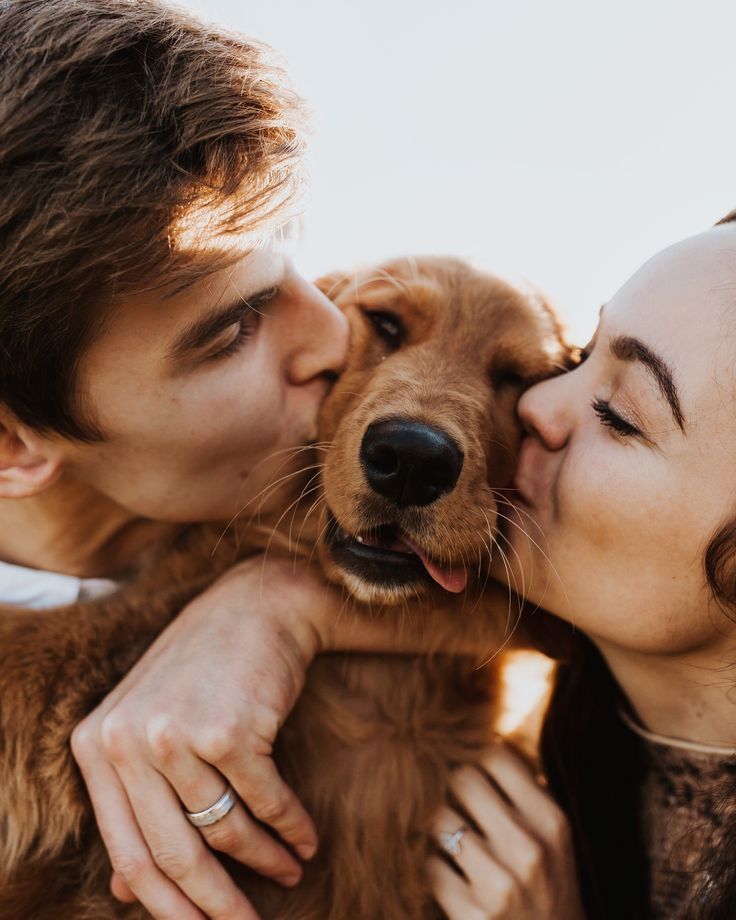 a man and woman kissing their dog on the forehead with an instagramr above them