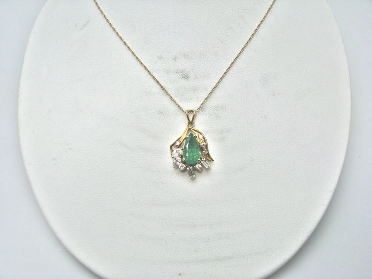 "For Sale: (1) H280 Stunning 14k Yellow Gold Emerald Necklace with Multiple Diamonds PLEASE READ ENTIRE DESCRIPTION BEFORE PURCHASING Pre-owned item. This is beautiful 14k yellow gold necklace featuring pear shaped Emerald in the center with multiple diamonds of different shape around it. No visible flaws, just some scratches please see pictures for details. Sold as is, as seen on pictures. There are earrings available that go with this necklace, and those earrings sold separately. Specifics: * Formal Pear-shaped Emerald Necklace In Fine Jewelry Style, Formal Pear-shaped Emerald Necklace Fine Jewelry, Formal Pear-shaped Emerald Necklace, Formal Pear-shaped Gemstone Necklaces, Formal Pear-shaped Gemstone Necklace, 14k Yellow Gold Jewelry For May Birthstone, Fine Jewelry Birthstone Necklace For Formal Occasions, Formal Fine Jewelry Necklace With Birthstone, Formal Emerald Pendant Necklace With Diamond Cut