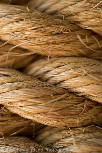 close up view of some straw that has been used as a wall hanging ornament