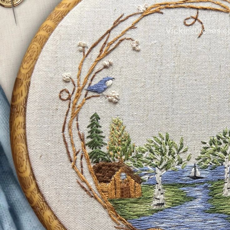 the embroidery is being worked on by someone