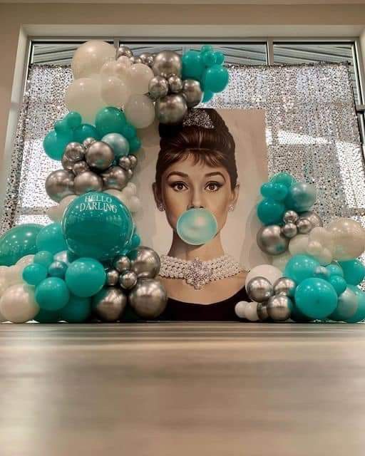 a photo frame made out of balloons with a woman's face on it