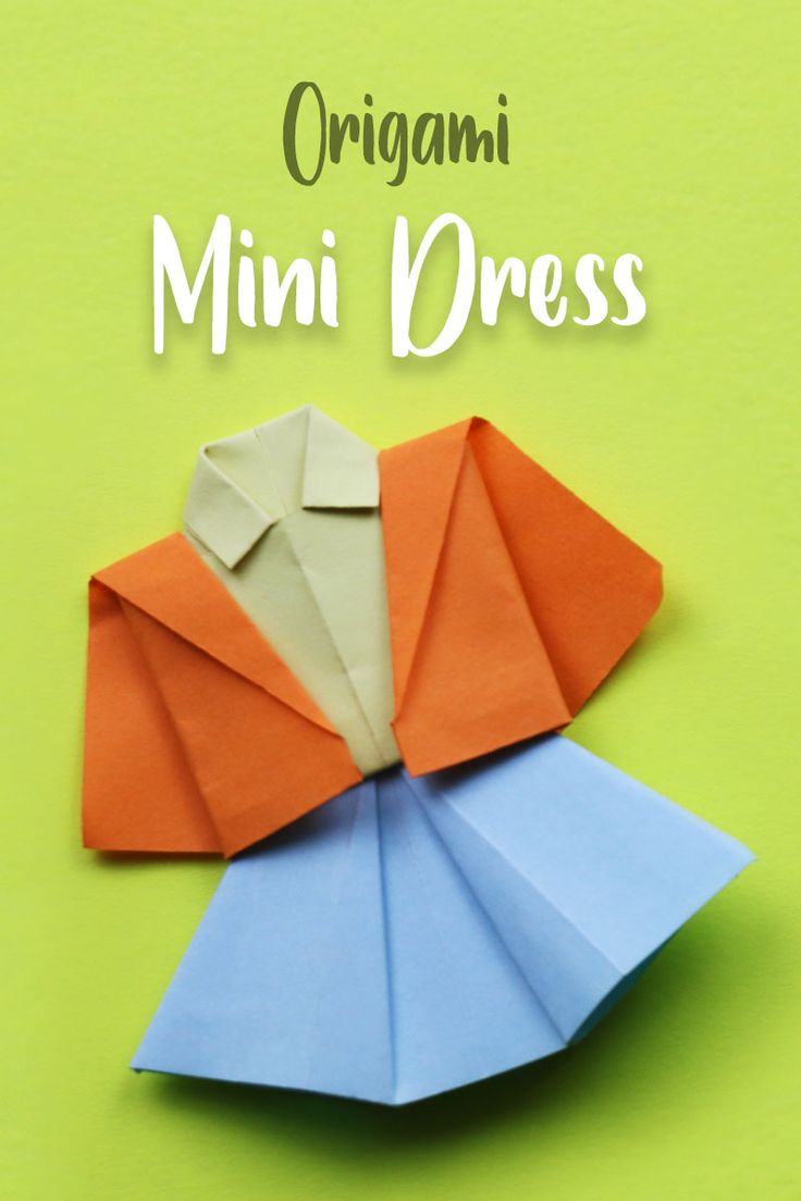 an origami shirt is folded up on top of another piece of paper with the words, origami mini dress