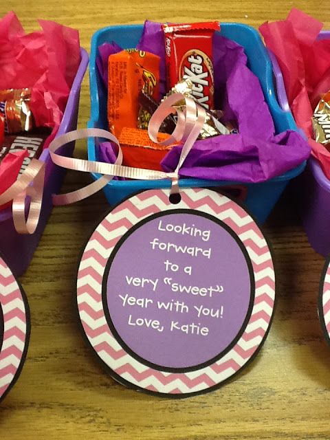 candy gift baskets with personalized tags on them