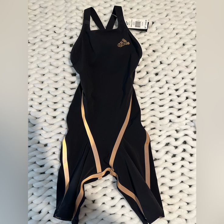 Adidas Swimwear Adizero 22” Black And Gold Metal Adidas Natacin Adizero 22” Negro Y Dorado Metlico Fina Av Approved 2020 Performance Swimsuit Strategically Placed Core-Positioning Tape Gripper Tape At Hem Size: 22” (2xs) Brand: Adidas Adizero Swim New With Tags Material: Main Material 74% Nylon 26% Spandex (Elastane) Lining 66% Nylon 34% Spandex Black Sporty Swimming Activewear, Black Breathable Sportswear Swimwear, Fitted Breathable Swimwear For Sports, Breathable Fitted Sportswear Swimwear, Black Compression Swimwear Elastane, Black Compression Swimwear With Elastane, Functional Black Activewear For Swimming, Black Athleisure Sleeveless Swimwear, High Stretch Black Swimwear For Sports