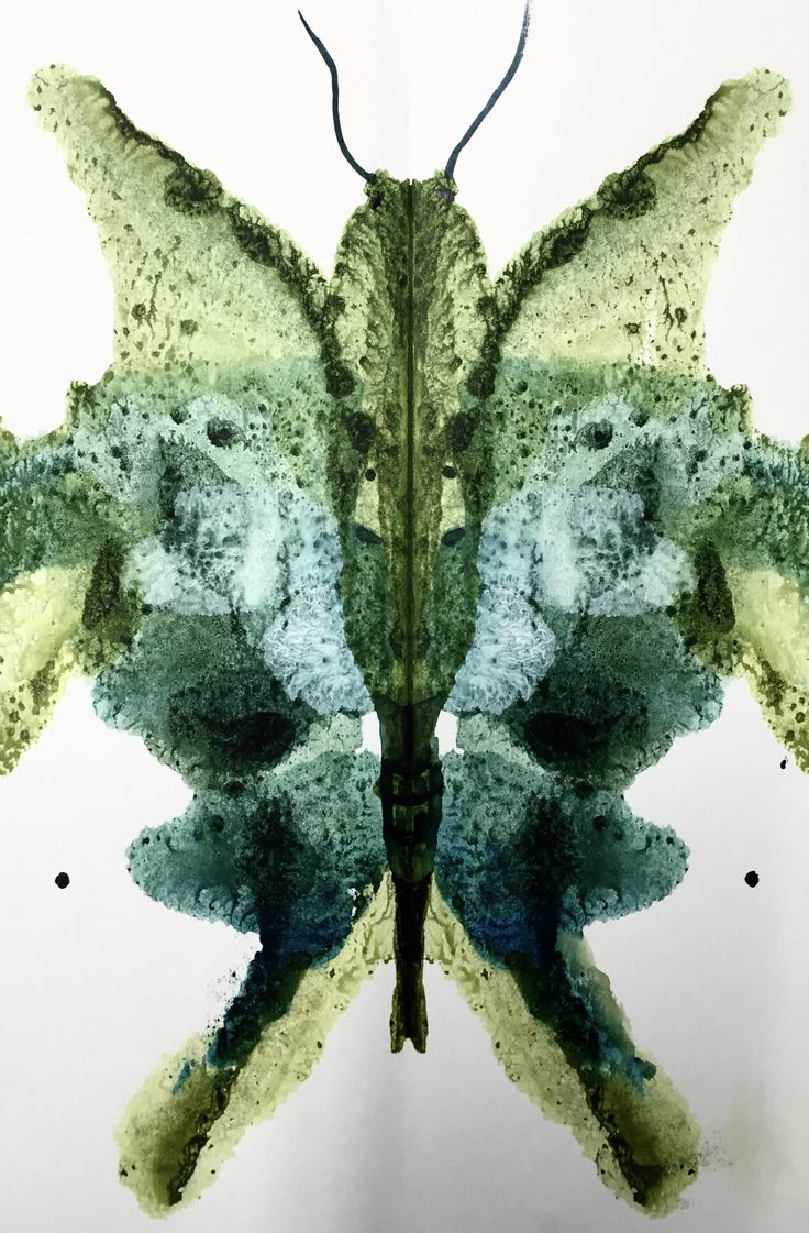 an abstract painting of a butterfly with green and blue colors on it's wings