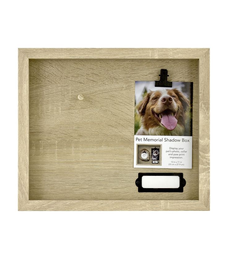 a dog's head is shown in a wooden frame with a clipboard attached to it