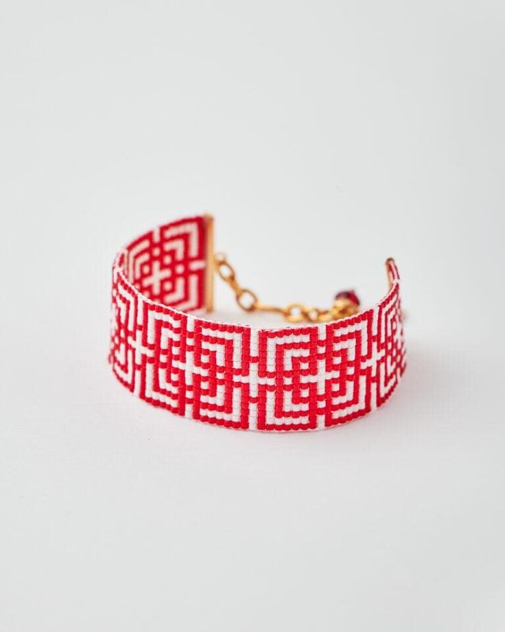 Handmade Red Labyrinth Miyuki Bracelet By The Gem Stories Embrace the bold, intricate design of the Red Labyrinth Miyuki Bracelet, a stunning piece of jewelry that combines traditional craftsmanship with modern style. Handwoven with high-quality Miyuki Delica beads in striking red and AB opal white, this bracelet's geometric pattern evokes the timeless allure of ancient labyrinths, symbolizing journey and discovery. Details: Material: Miyuki glass beads, 24k gold-plated clasp Technique: Loom sti Symbolic Red Beaded Bracelets For Gifts, Handmade Red Symbolic Beaded Bracelets, Symbolic Red Round Beads Jewelry, Red Symbolic Bracelet Jewelry, Red Bangle For Jewelry Making, Red Bohemian Cuff Bracelet As Gift, Symbolic Red Bracelet Jewelry, Bohemian Red Cuff Bracelet As Gift, Bohemian Style Red Cuff Bracelet As Gift