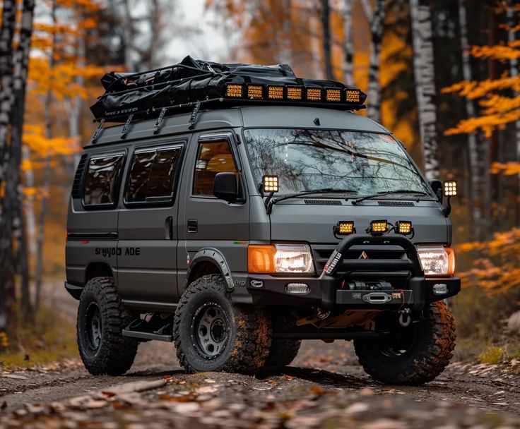 an off road vehicle is parked in the woods