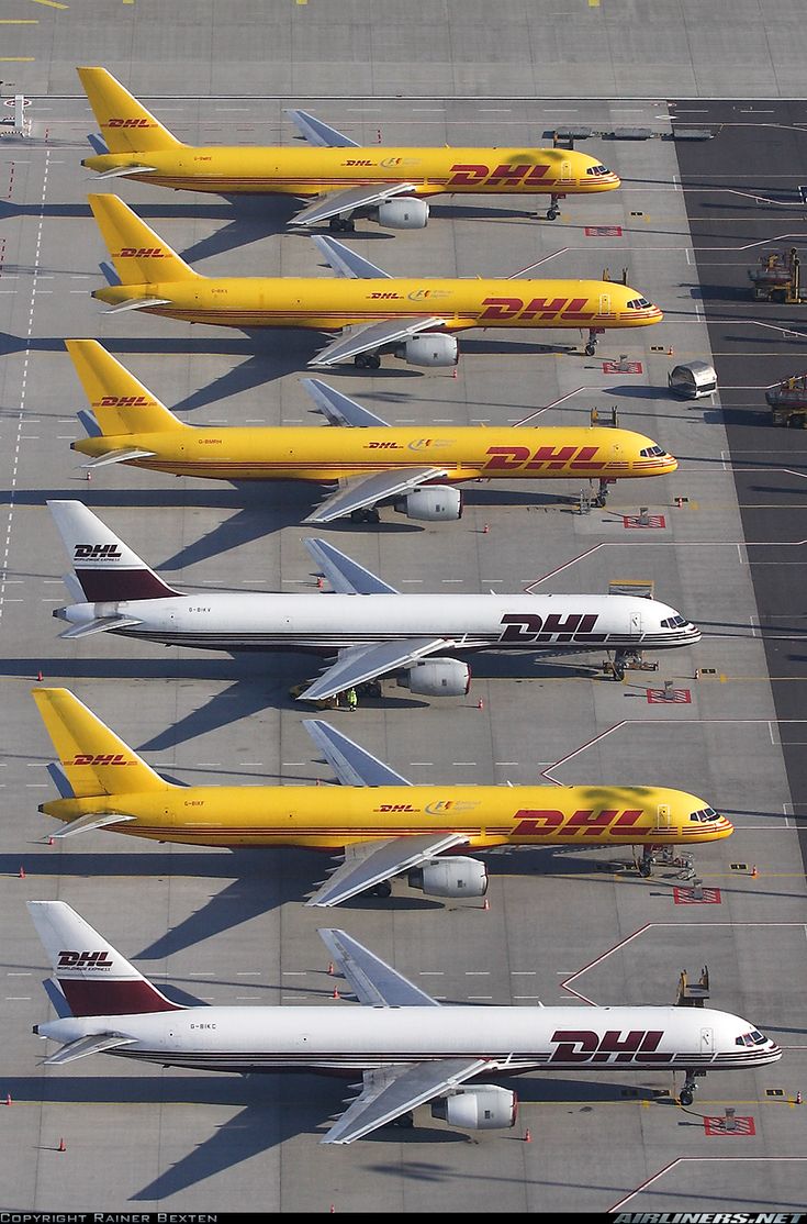 several planes are lined up on the tarmac at an air port run - way