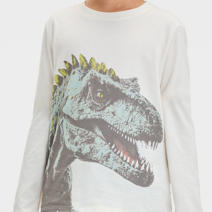 Spruce up your child's casualwear wardrobe with this Long-Sleeve 'Photo Reel Dinosaur' Graphic T-Shirt from Cat & Jack™. Made from midweight cotton-blend jersey fabric, this long-sleeve crewneck tee brings laid-back comfort to their day. Designed in a cream hue, this crewneck tee features a graphic of a T-Rex on the front for fun, prehistoric flair. Cat & Jack™: Designed for all children so you can trust it's made for yours. Photo Reel, Dinosaur Graphic, Kids Clothes Boys, Dark Yellow, Fabric Tape, Top Graphic Tees, Boys Long Sleeve, Cat & Jack, Pair Of Pants