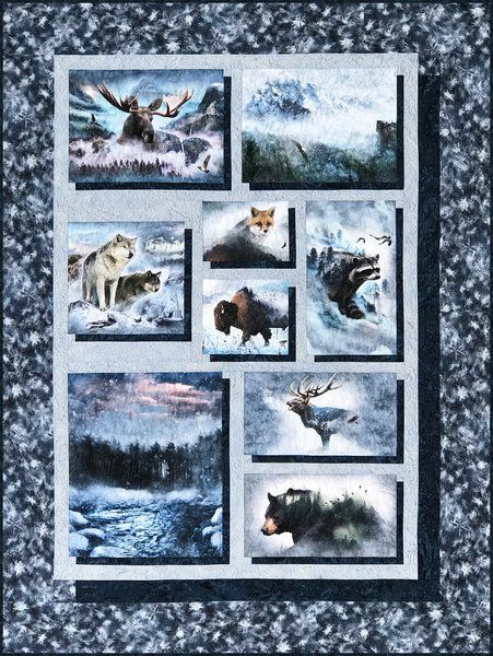 a quilt with pictures of animals in the snow and on it's sides is an eagle