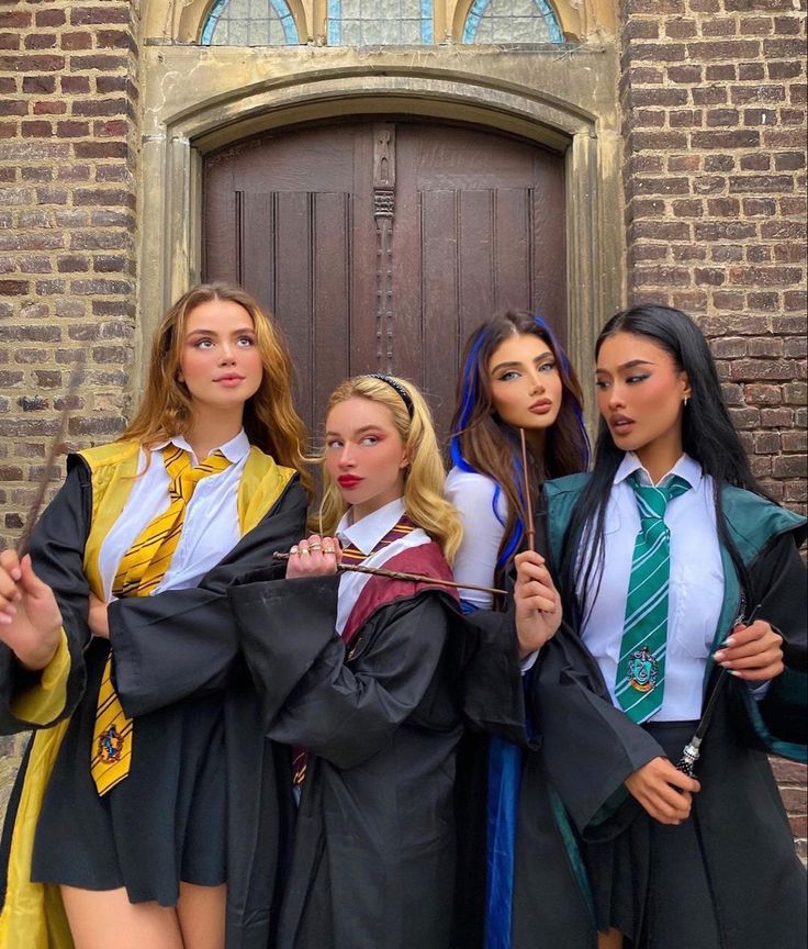 four young women dressed in harry potter costumes