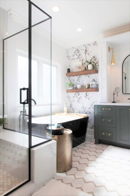 a bath room with a tub a sink and a mirror on the wall in it