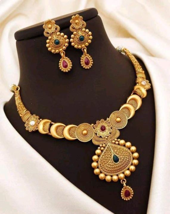 Material:- Brass, Gold Platted Pack- Necklace Set These Beautiful Gold Platted Necklace Best for gifting and personal use, You can gift your Girlfriend, Mother, Sister , Relatives , Neighbours etc. Combine it with Matching Dress and be the Limelight of every Occasion ( Diwali, Birthday, Anniversary, Christmas, Any Ritual Festival). Suitable for all Occasions. a)These are very skin Friendly. b)The plating is Non- Allergic and safe for all Environment. Gift for Her, Best Friend Gift, Gift Ideas, Valentines Day Gift,Teacher appreciation Gift, Girl Friend Gift, Friendship Gift, Teacher Gift, Mother's day Gift from Daughter, Christmas Gift, Engraved, Gift for Her, Anniversary Gift for Wife, Anniversary Gift for Girlfriend, Valentines Day Gift for Him, Birthday Gift for Him, Graduation Gift for Gold Plated Bollywood Necklace As Gift, Bollywood Style Gold Plated Necklaces As Gifts, Bollywood Style Gold Plated Necklaces, Bollywood Style Gold Plated Necklace Gift, Round Coin Pendant Jewelry For Festivals, Bollywood Style Metal Necklace For Gift, Round Festival Coin Pendant Jewelry, Festival Coin Pendant Jewelry, Metal Kundan Necklace For Festivals And Gift