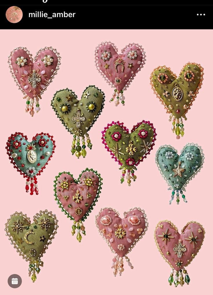 a bunch of heart shaped brooches on a pink background with text that says, i love you