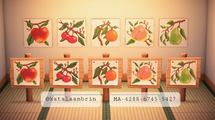 four paintings with fruit on them in a room