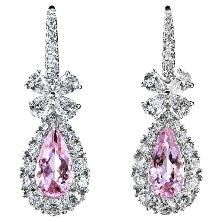 Fabulous platinum drop earrings feature pink emeralds - natural morganites just under two carats, each embedded in graduated diamond clusters. The pear-shaped pendants, diamond bows, and pave-studded French wires are connected with flexible hinges allowing the stunning chandeliers to tremble with your every step. The tender pink of the morganites in a ring of brilliant fire combined with the innocent sweetness of the diamond bow will turn your red carpet entrance into a paparazzi-infused scene. Red Carpet Entrance, Leon Mege, Beautiful Diamond Earrings, Pearl Chandelier Earrings, Diamond Chandelier Earrings, Titanic Jewelry, Diamond Chandelier, Pear Shaped Pendant, White Diamond Earrings