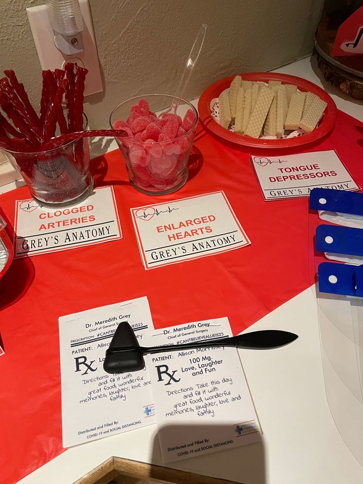 a table topped with lots of different types of snacks and desserts on top of it