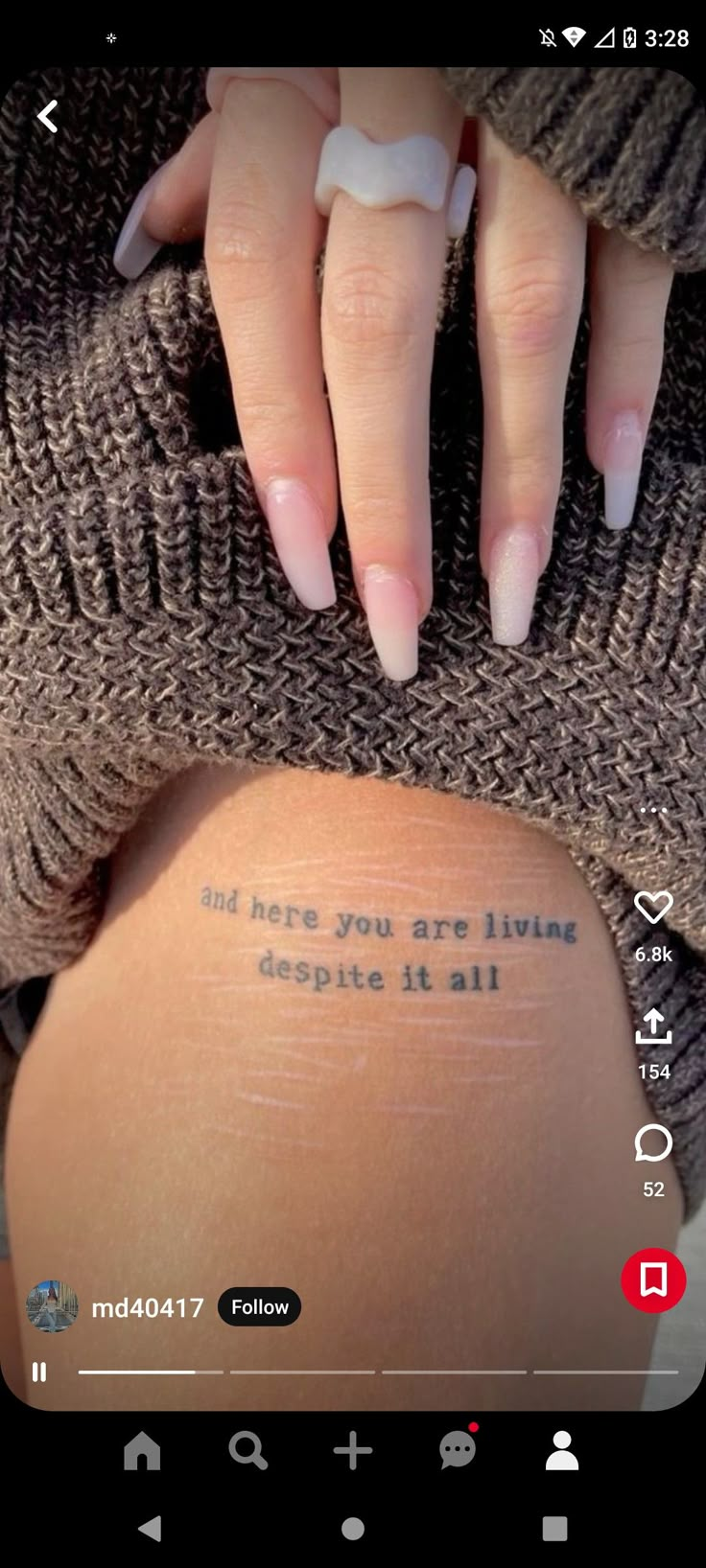 someone is holding their hand on the back of her thigh with a tattoo that reads and hope you are living despite it all