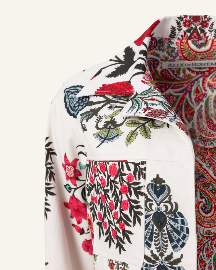 a white shirt with colorful designs on it