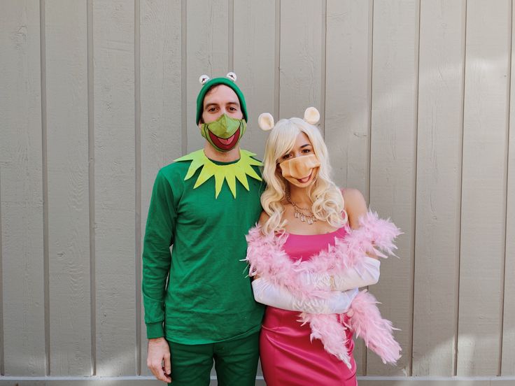 a man and woman dressed up in costumes