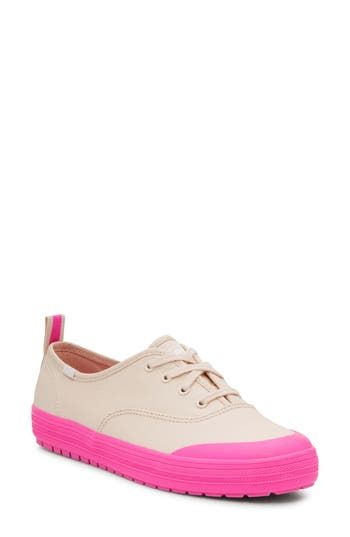 A thick rubber toe rand enhances the casual appeal of this classic sneaker set atop a durable sole with plush cushioning on the inside. Lace-up style Cushioned footbed Textile upper and lining/rubber sole Imported Pink Casual Sneakers With Round Toe, Pink Sneakers With Contrast Sole For Spring, Pink Sneakers With Textured Sole For Streetwear, Casual Pink Sneakers With Vulcanized Sole, Spring Pink Sneakers With Contrast Sole, Casual Cream Sneakers With Rubber Toe Cap, Pink Casual Slip-on Sneakers, Pink Sporty Sneakers With Textured Sole, Sporty Pink Sneakers With Textured Sole