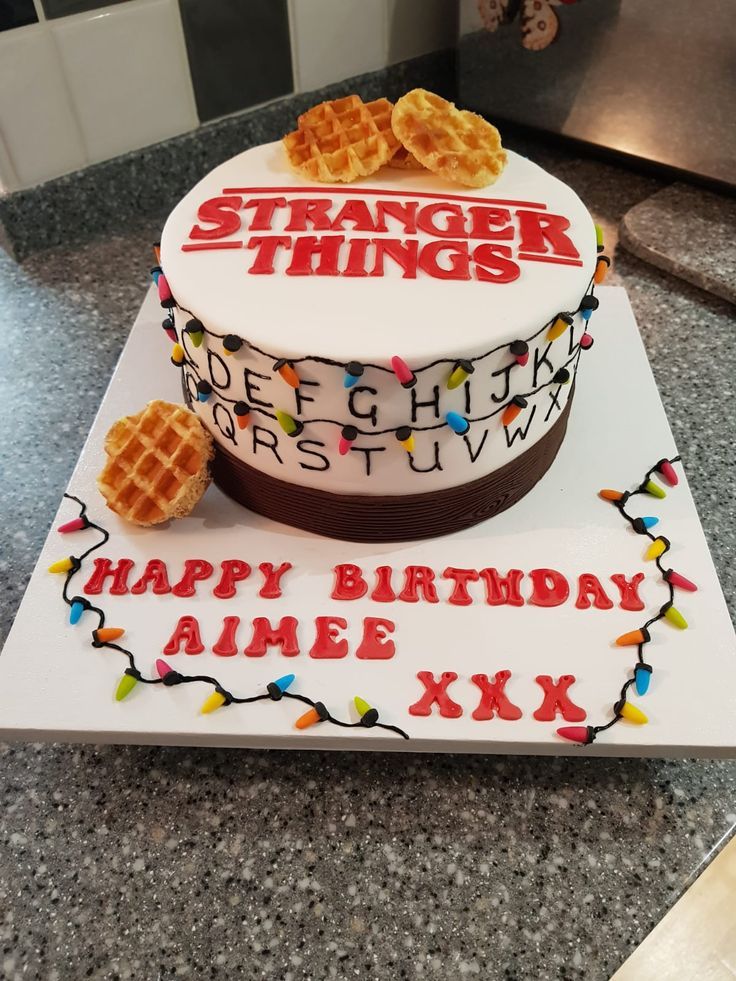 a birthday cake with waffles and letters on it