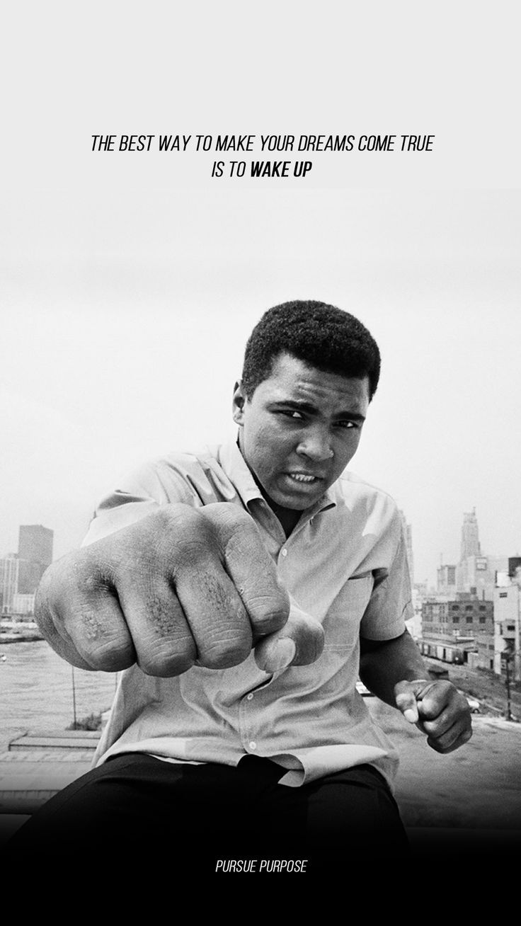 a black and white photo of a man pointing his finger at the camera with a quote above it