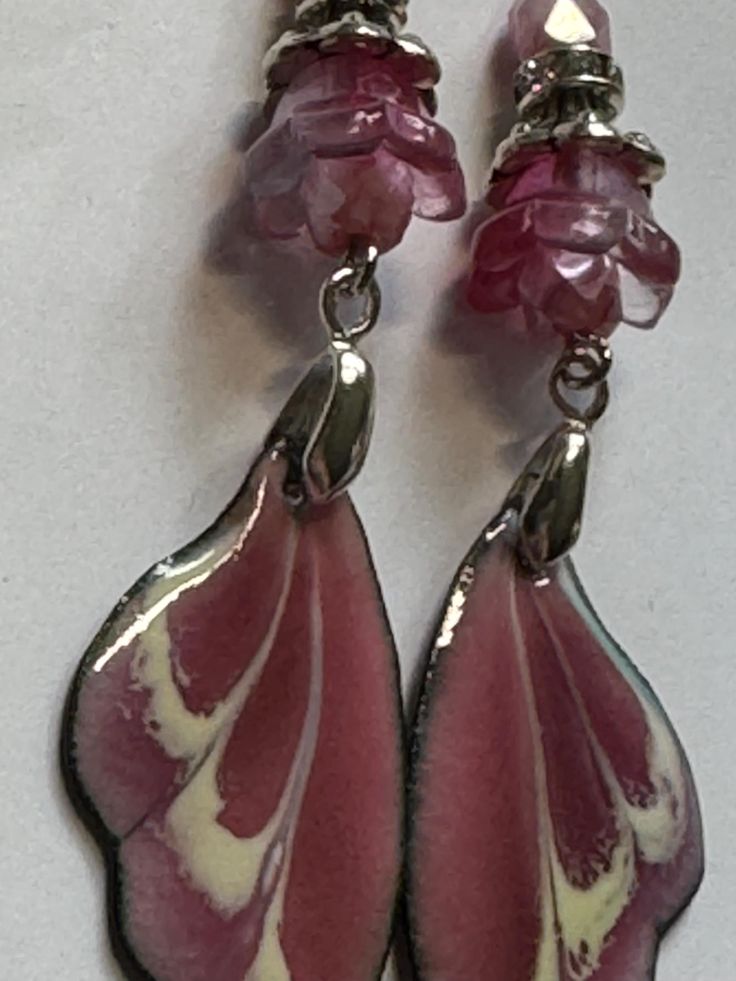 Handmade OOAK dangle earrings made with ARTISAN ENAMELED WINGS CHARMS by Sabrina Designs, a Lampwork bead artist. I also used Czech glass and glass beads and silver metal findings to complete these earrings. They are about 2.75" dangle. Pink Metal Clip-on Earrings For Gift, Pink Metal Clip-on Earrings As A Gift, Whimsical Silver Glass Jewelry, Whimsical Czech Glass Silver Jewelry, Handmade Pink Glass Jewelry, Whimsical Silver Czech Glass Jewelry, Silver Czech Glass Jewelry For Crafting, Handmade Iridescent Czech Glass Earrings, Pink Teardrop Beads For Jewelry Crafting