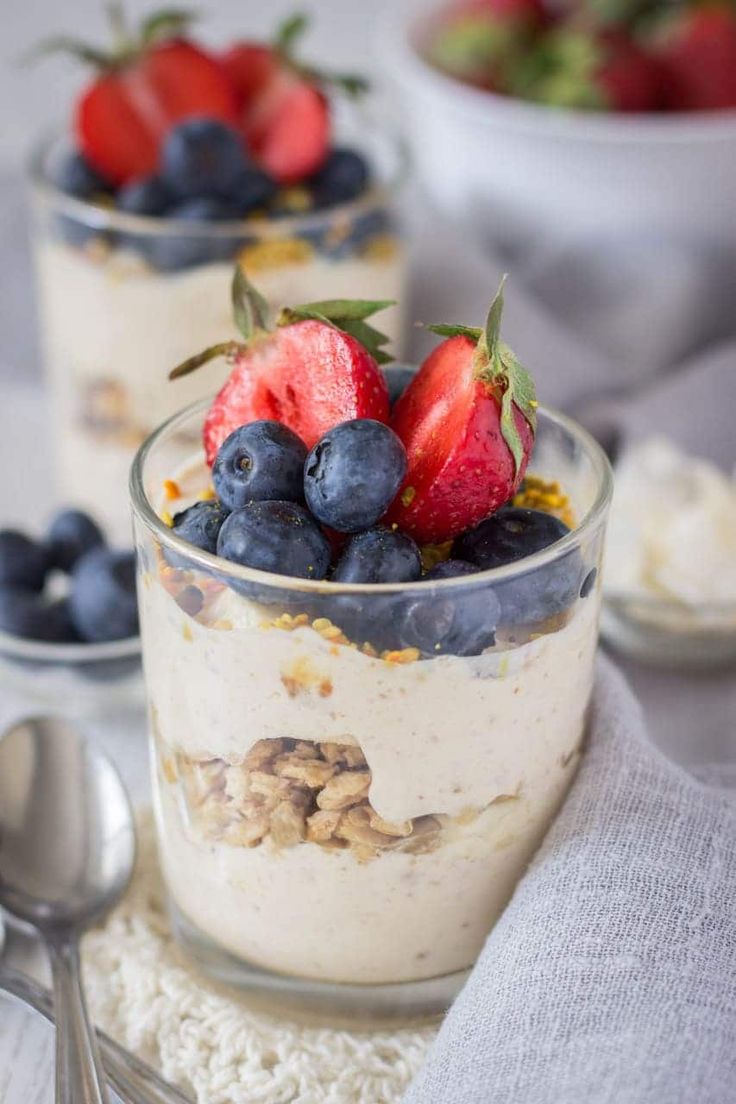 two desserts with strawberries and blueberries in them