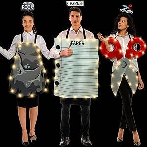 three people in costumes holding up signs with lights on them that say paper and scissors