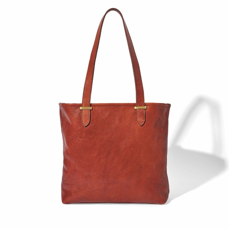 Classic Tote Bag – Handcrafted in Regenerative American Leather Introducing our Classic Tote Bag, expertly handcrafted from luxuriously soft regenerative American leather. This spacious, durable, and versatile tote is perfect for everyday use, seamlessly blending style and functionality. Key Features: Spacious Design: The tote's roomy interior can accommodate a laptop up to 14 inches, making it ideal for work or travel. Secure Storage: A large zip-top canvas pouch snaps into place at the sides f Rectangular Textured Leather Hobo Bag For Travel, Versatile Tote Bag With Smooth Grain, Versatile Smooth Grain Tote Bag, Versatile Hobo Bag With Smooth Grain For Everyday Use, Versatile Smooth Grain Hobo Bag For Everyday Use, Versatile Hobo Bag For Everyday Use With Smooth Grain, Modern Hobo Bag With Smooth Grain For Everyday Use, Smooth Grain Hobo Shoulder Bag For Everyday Use, Smooth Grain Leather Hobo Shoulder Bag For Everyday Use