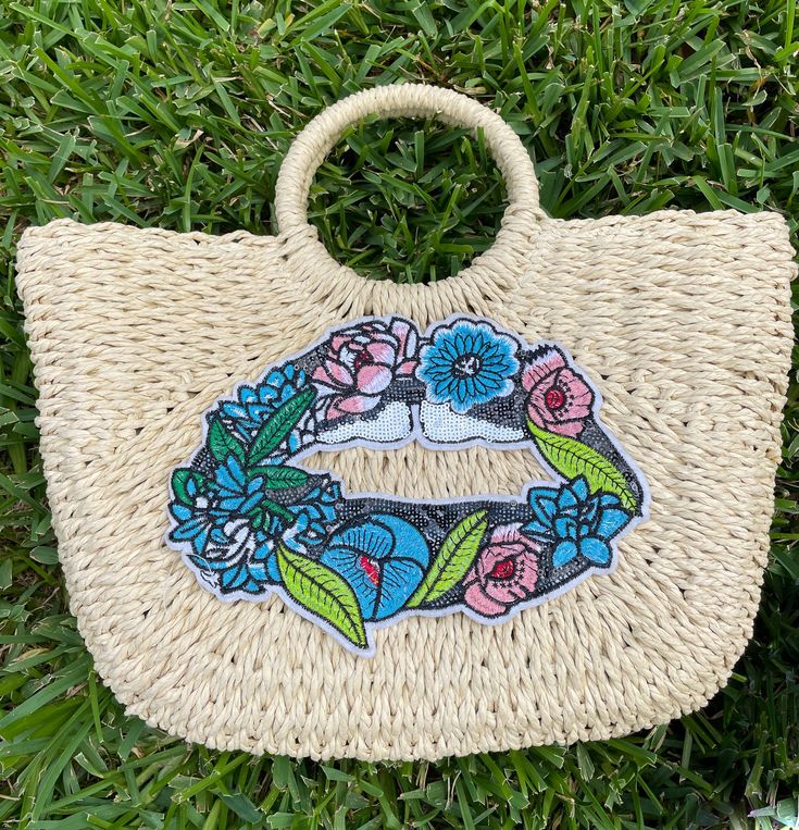 ✨ This is your perfect straw bag! Unique and glamorous, make a statement with your custom bag and instantly dress up any outfit and look stylish on vacation to the beach or lake! It is the perfect size to fit all of your essentials - phone, makeup, keys, wallet, etc. 💖 Size 15" wide on top, 11' wide on bottom x 10" length💖 Straw bag with circle top handles💖 Cream lining💖 Inside pocket💖 Full closure with drawstrings on both sides inside❣️❣️❣️ I do offer discounts for ordering in bulk - send Flower Lips, Circle Top, Crystal Pen, Cruise Trip, Straw Beach Bag, Pool Day, Pink Feathers, Embroidered Bag, Unique Bags