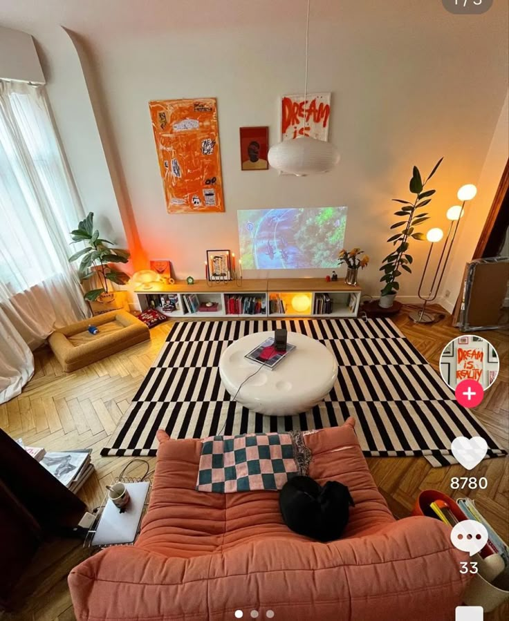 a living room with an orange couch and black and white checkerboard rug on the floor