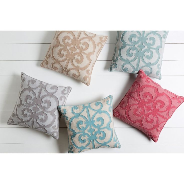 four decorative pillows in various colors