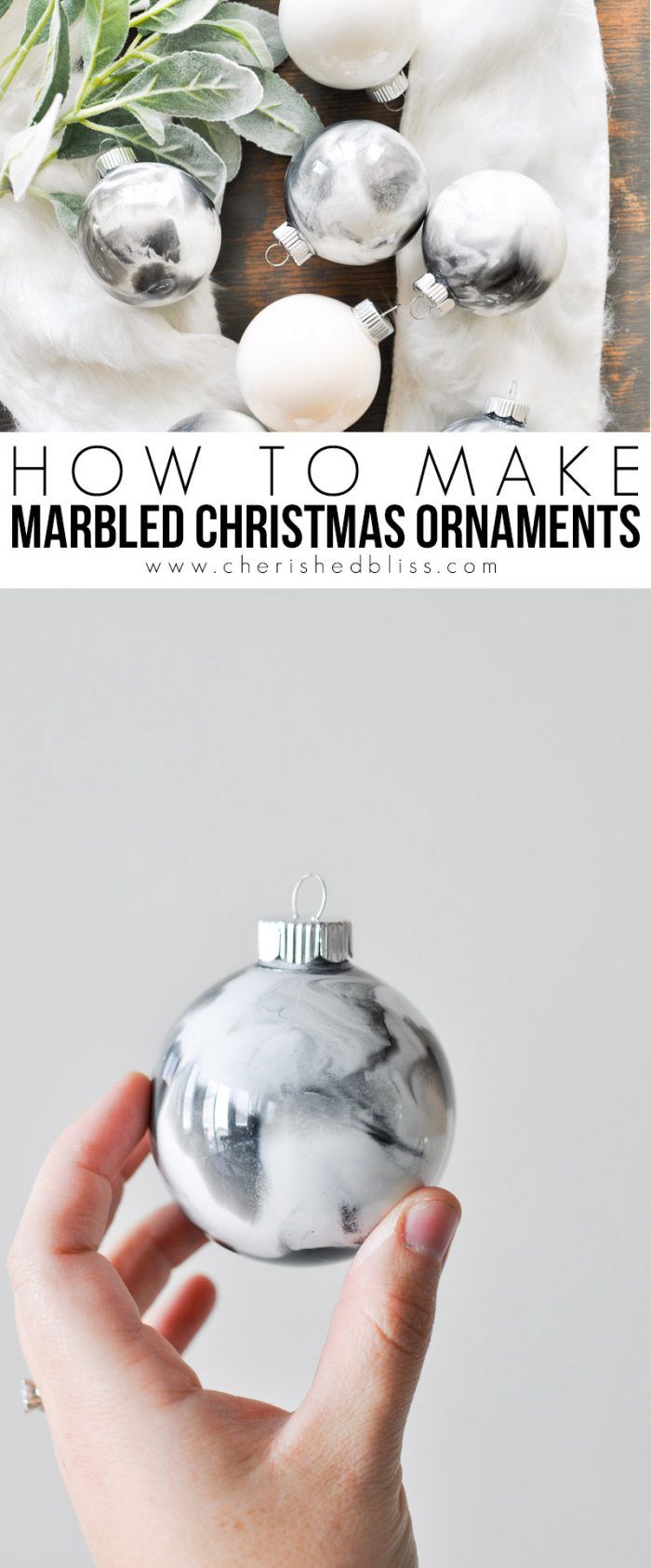 a hand holding a marbled christmas ornament in front of a white background