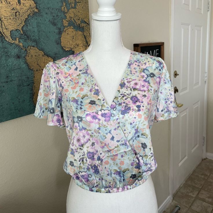 Astr Blue Floral Blouse Nwot So No Flaws, Damage And Never Worn Before. Features A Beautiful Butterfly Neck And A Faux Wrap. Flowers Are Purple, Blue And Some Orange/Pink Color. These Pictures Don’t Give Them Justice. Offers Welcome :) Size Extra Small 100% Polyester Dry Clean Only Feminine Fitted Multicolor Tops, Fitted Feminine Multicolor Tops, Multicolor Crop Top Blouse For Spring, Multicolor Cropped Blouse For Spring, Wrap Flowers, Orange Pink Color, Blue Floral Blouse, Beautiful Butterflies, Floral Blouse