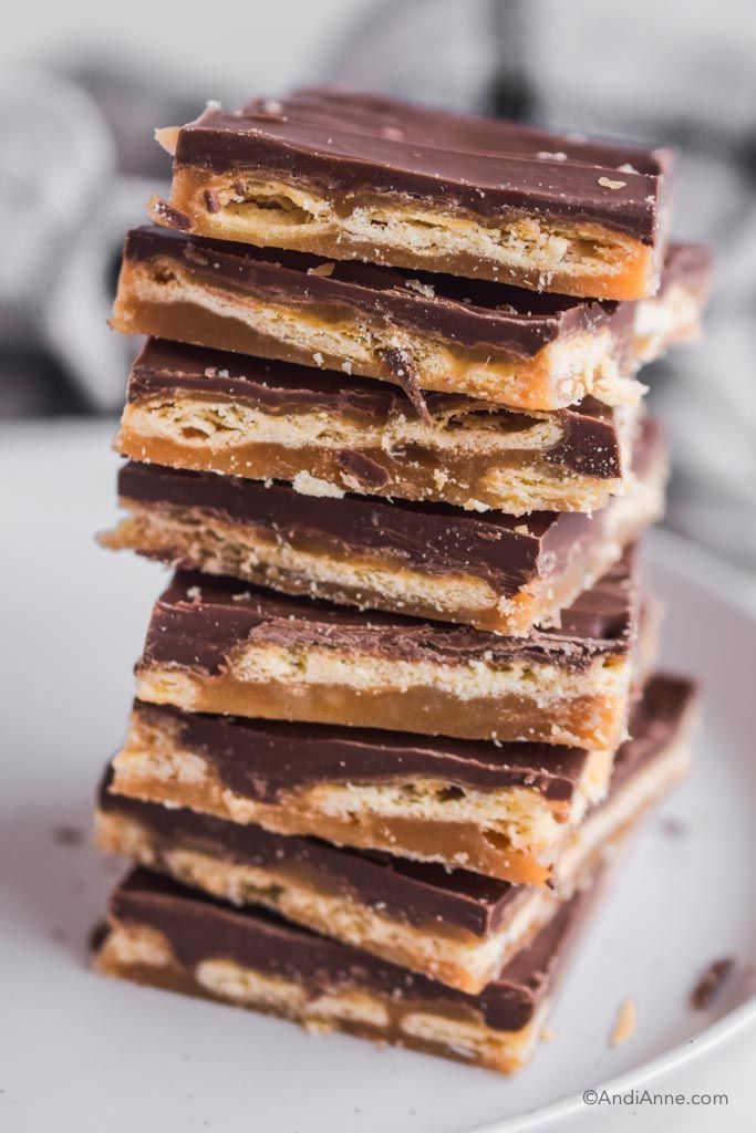 a stack of chocolate and peanut butter bars on a white plate