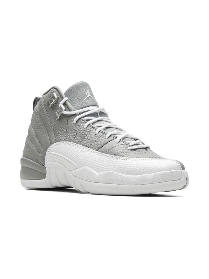 grey/white leather panelled design logo pull-tab at the heel signature Jumpman motif round toe front lace-up fastening ankle-length chunky rubber sole These styles are supplied by a premium sneaker marketplace. Stocking only the most sought-after footwear, they source and curate some of the most hard to find sneakers from around the world. Air Jordan 12, Air Jordan 12 Retro, Jordan 12 Retro, Jordan 12, Jordans 12, Kids Jordans, Sneakers Grey, Pull Tab, Boys Shoes