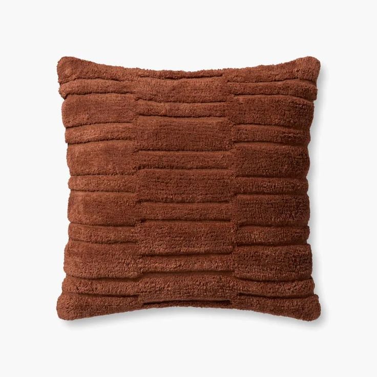 a brown pillow on a white background