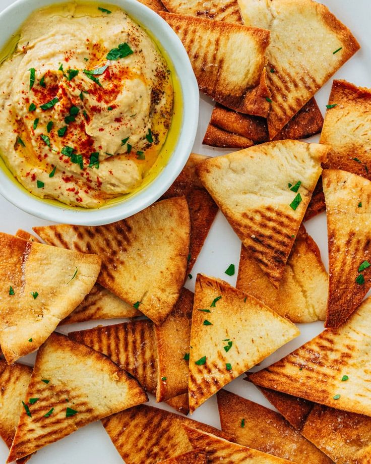 pita chips with hummus and olive dip