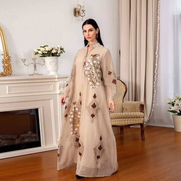 Beige Motif dress - this elegant abaya style dress in beige offers patches of sequence work on opposing sides of the dress. This dress also has embroidered motifs through out the dress including the back . This is a loose fitting comfortable dress for the occasion of your choice. Available in sizes S-2XL shipping available worldwide 😊 DM to order 💃 #formaldress #dressfashion #dressboutique #dressdenim #greendress #dressy #dresskantor #dress #longsleevedress #mididress #dressesonline #eveningdresses #dressshopping #longdresses #shortdresses #elegantdresses #shortdress #eveningdress #dresses👗 #dressoftheday #toronto #koonj #shawls #arabicdress #pakistanifashion #hijabi #modest #modestwear #modestdress #plussize Muslim Evening Dresses, Embroidered Kaftan, Muslim Dresses, Kaftan Abaya, Dubai Abaya, Dress Muslim, Eid Dresses, Moroccan Caftan, Muslim Outfits