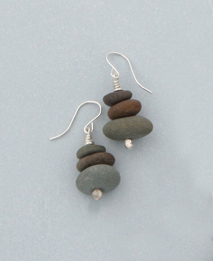 Cairns have been used in many cultures to guide one along a path, mark a sacred place, or represent spiritual guidance. Cairn symbolizes direction, safety, and hope for travelers moving along life’s paths. Inspired by Zen beliefs and practices, this jewelry is created to be an embodiment of stability and direction for the wearer. Made of natural beach stone Stones measure about 0.3 -0.4 inches Hanging length: 1 inch Sterling silver ear wire Made in the USA Handmade from natural Cape Cod beach st Cairn Jewelry, Sea Jewellery, Rocks Jewelry, Earthly Tones, Beach Stones Jewelry, Stone Ideas, Pebble Jewelry, Pendant Ideas, Buddha Jewelry