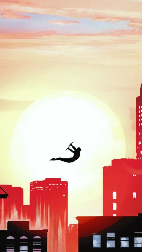 a person jumping in the air over a city with tall buildings and a sun setting behind them