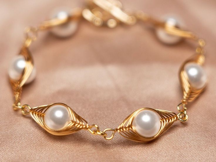 Angel Eye Wrapped Pearl Bracelet purely handmade An angel's eye pattern outlined with 14K gold thread, with a natural pearl in the middle. All jewellry comes with a beautiful gift box, so your item is ready to be gifted. Wear it to bring more beauty.Hope you like it. Gold Pearl Jewelry Wire Wrapped, Elegant Wire Wrapped Bracelet Jewelry, Elegant Wire Wrapped Bracelet, Elegant Wire Wrapped Pearl Bracelet, Elegant Hand Wrapped Jewelry For Anniversary, Elegant White Wire Wrapped Pearl Bracelet, Elegant Hand Wrapped Gold Jewelry, Wire Wrapped Pearl Jewelry In Yellow Gold, Handmade Gold Pearl Bracelet For Wedding