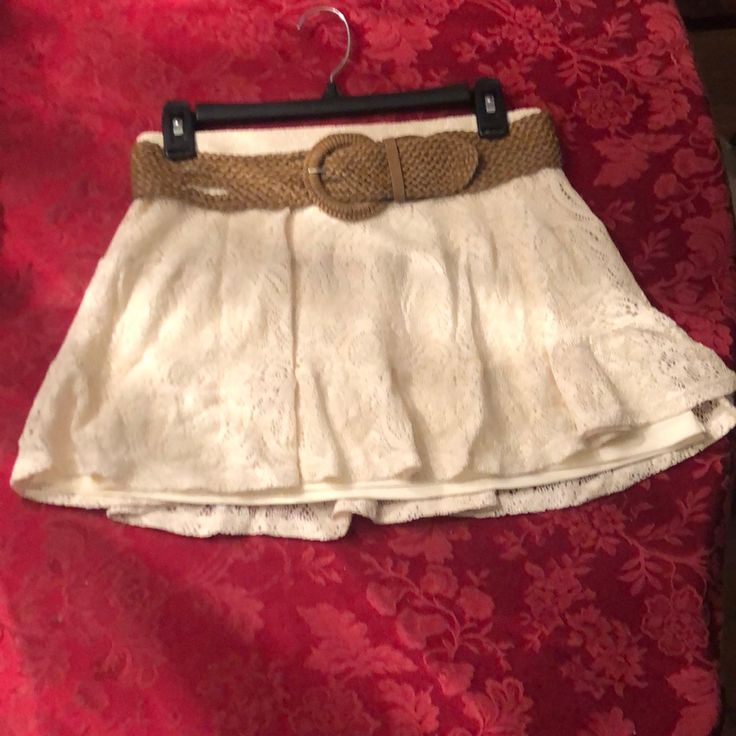 Size Small Juniors Ivory Crocheted Lace Skirt With Lining Underneath. Flowy Mini Skirt With Dark Tan Adjustable Belt. Excellent Condition Nwt Beige Flowy Lace Skirt, Cream Skirt Bottoms For The Beach, Cream Skirted Bottoms For Day Out, Beige Bottoms With Lace Trim Flowy Design, Elegant Lace Bottoms For Vacation, Cream Lined Skort For Summer, Summer Casual Lace Mini Skirt, Casual Lace Mini Skirt For Summer, Cream Skirt For Vacation