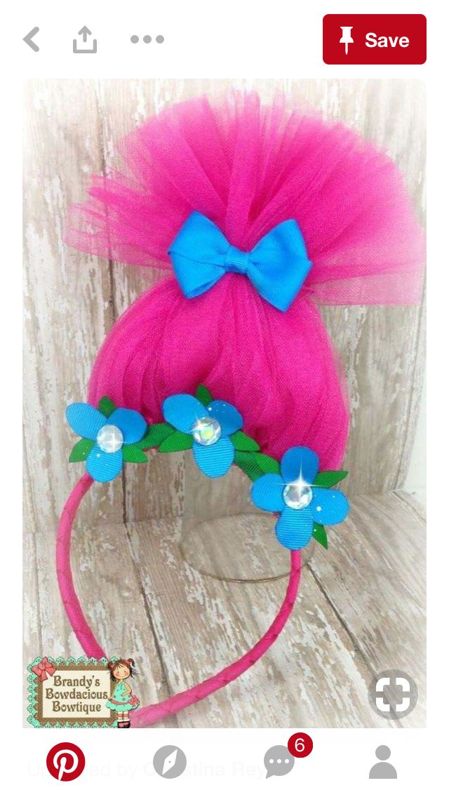 a pink headband with blue flowers on it