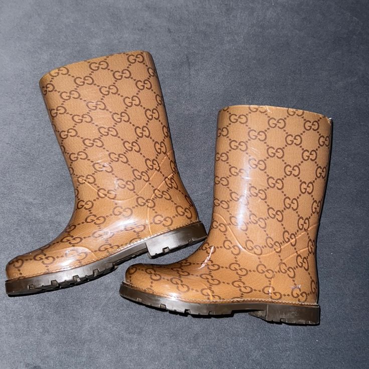 Sold Out Everywhere Authentic Gucci Rain Boots Super Cute In Great Condition Size 27 Which Is A 10.5 Can Fit Size 10-11 Gucci Snow Boots, Gucci Rain Boots, Gucci Bee Boots, Gold Knee-high Winter Boots, Luxury Brown Snip Toe Knee-high Boots, Gucci Shoes, Rain And Snow Boots, Snow Boots, Rain Boots