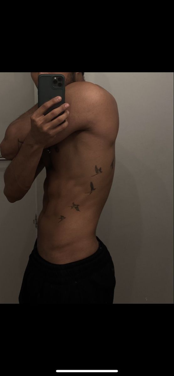 Bird tattoo Bird Side Tattoo Men, Men’s Bird Tattoo Arm, Bird Tattoo Men Back, Small Tattoos For Men Birds, Mens Birds Tattoo, Birds On Ribs Tattoo Men, Men Ribs Tattoo Ideas, Birds On Side Tattoo Men, Birds Going Up Arm Tattoo